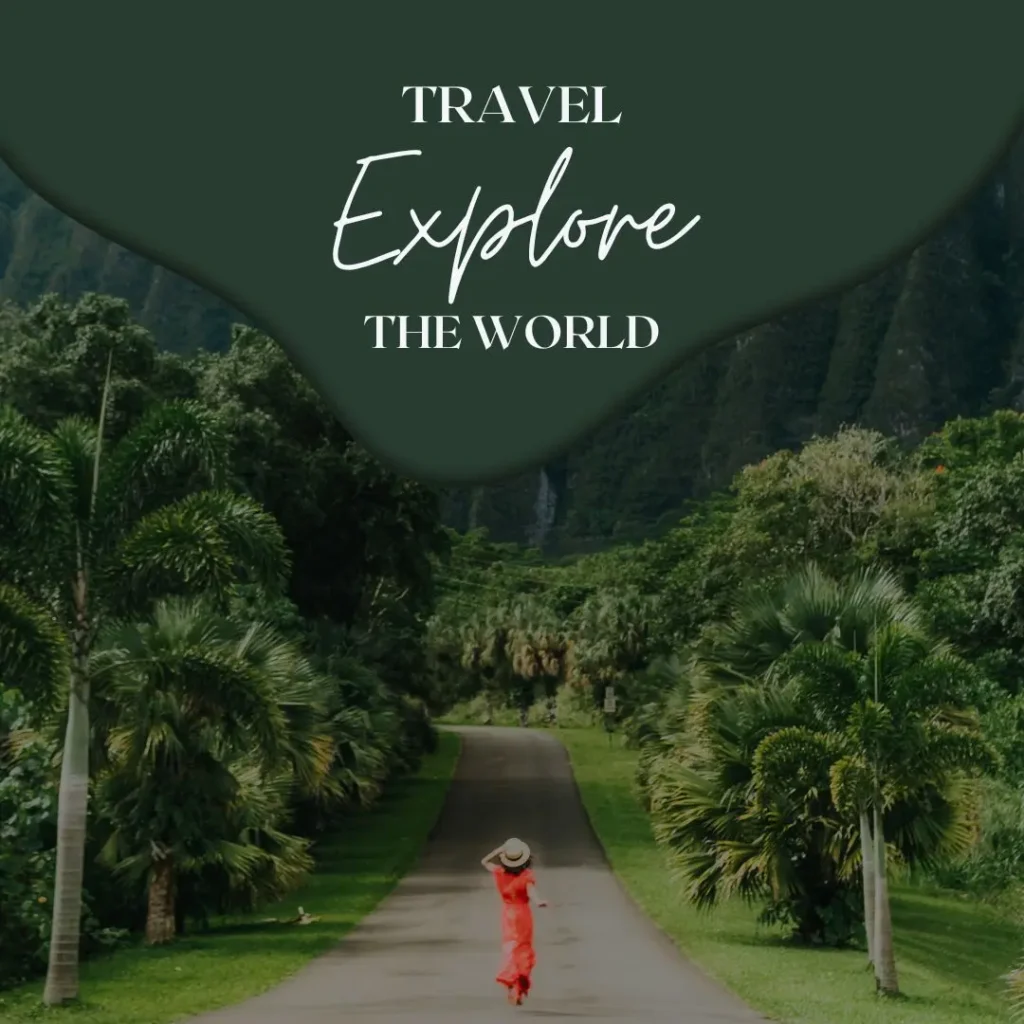 a-woman-in-a-red-dress-walks-down-a-lush-tropical-road-with-mountains-in-the-background